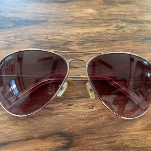 Michael Kors aviators. Minor scratch on the right lens.